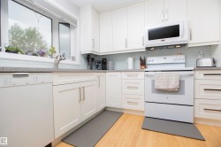 White cabinetry with brushed nickel hardware - 