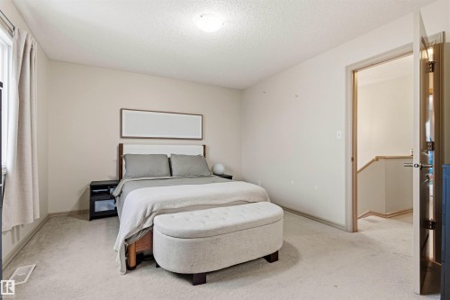 Interior space with neutral wall tones and light-toned carpeting - 14807 141 Street, Edmonton, AB 