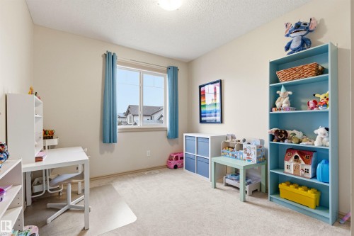 Room with light-toned walls and carpeted flooring - 14807 141 Street, Edmonton, AB 
