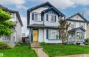 Light blue siding exterior with dark blue trim accents - 14807 141 Street, Edmonton, AB 