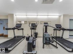 Dedicated fitness area featuring multiple cardio machines - 