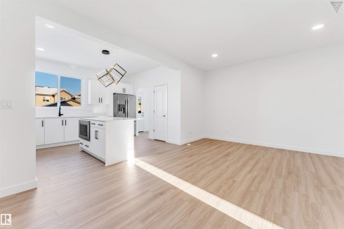 Open-concept kitchen and living area featuring wood-finish flooring - 1224 14 Avenue Nw, Edmonton, AB - Indoor Photo Showing Kitchen