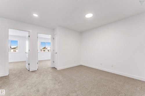 Carpeted room with recessed lighting, white walls, and white trim - 1224 14 Avenue Nw, Edmonton, AB - Indoor Photo Showing Other Room
