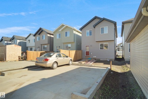 Modern two-story residence featuring light gray siding and contrasting dark trim - 1224 14 Avenue Nw, Edmonton, AB - Outdoor