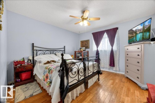 Light blue walls with wood-finish flooring - 5108 138A Avenue, Edmonton, AB 