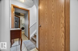 Panel door with a wood-grain finish and a polished chrome knob - 
