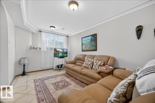 Interior room featuring light-toned walls and crown molding - 5108 138A Avenue, Edmonton, AB 