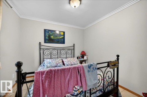 Neutral wall color, crown molding, and tiled flooring - 5108 138A Avenue, Edmonton, AB 