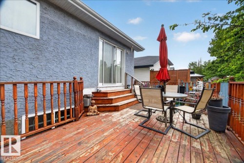 Spacious wooden deck with natural wood railing and privacy lattice - 5108 138A Avenue, Edmonton, AB 