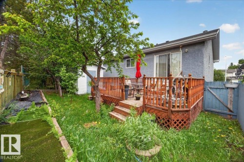 Rear wood deck with lattice skirting and steps - 5108 138A Avenue, Edmonton, AB 
