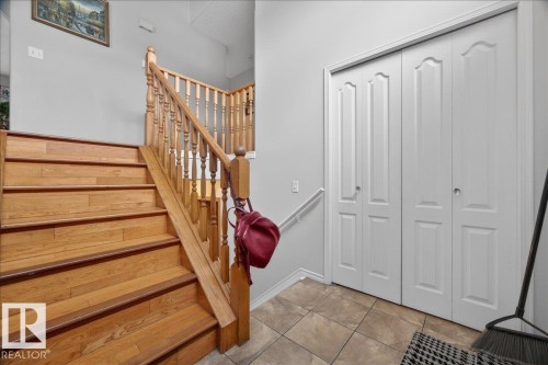 Hardwood staircase with natural wood balusters and handrail - 5108 138A Avenue, Edmonton, AB 