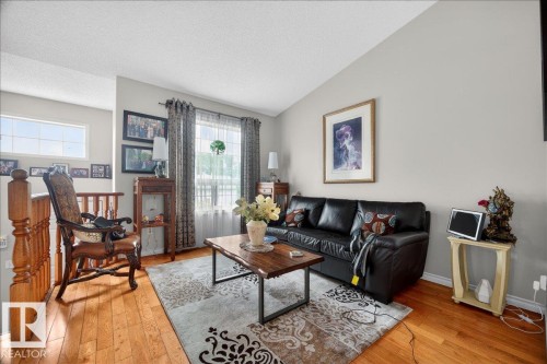 Bright living area featuring wood-finish flooring - 5108 138A Avenue, Edmonton, AB 