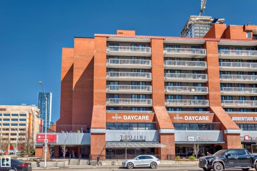 Multi-story building featuring a brick exterior with multiple balconies - 706 10125 109 Street, Edmonton, AB 