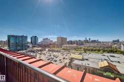 Expansive city skyline with multiple high-rise buildings and surrounding commercial structures - 