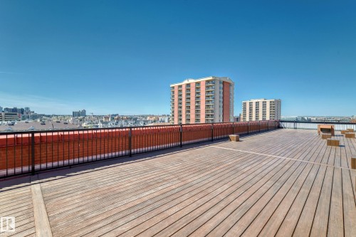 Expansive rooftop deck with wood-finish flooring - 706 10125 109 Street, Edmonton, AB 