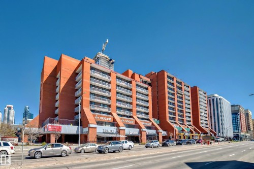 Multi-story building featuring a prominent brick exterior and multiple private balconies - 706 10125 109 Street, Edmonton, AB 