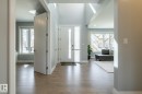 Foyer entrance with light wood-type flooring and recessed lighting - 10936 71 Avenue, Edmonton, AB 