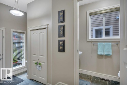 Front entrance and 2-pc. bath - 10 15151 43 Street, Edmonton, AB - Indoor Photo Showing Other Room