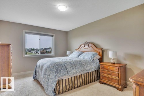 West facing windows with plenty of natural light - 10 15151 43 Street, Edmonton, AB - Indoor Photo Showing Bedroom