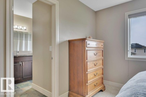 Looking into Primary 4-pc. Ensuite and Walk-in-Closet - 10 15151 43 Street, Edmonton, AB - Indoor Photo Showing Bedroom