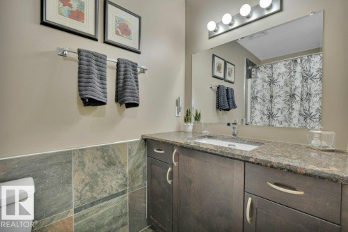 Main bathroom - 4-pc. with stacked laundry - 10 15151 43 Street, Edmonton, AB - Indoor Photo Showing Bathroom