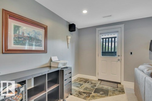 Walkout leading to private West-facing patio - 10 15151 43 Street, Edmonton, AB - Indoor Photo Showing Other Room