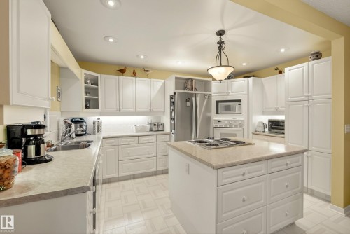 Contemporary kitchen featuring white cabinetry and light-toned countertops - 78 Goodridge Drive, St. Albert, AB 