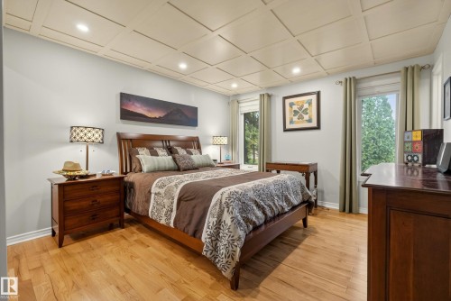 Recessed lighting illuminating a coffered ceiling, hardwood flooring, and neutral wall tones - 78 Goodridge Drive, St. Albert, AB 