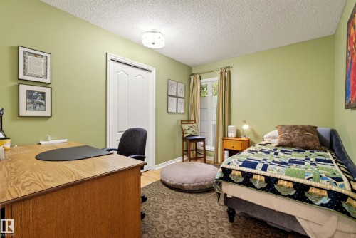 Room featuring wood-finish flooring and light green wall paint - 78 Goodridge Drive, St. Albert, AB 