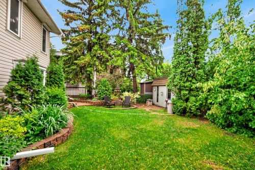 Expansive green lawn with established trees and shrubs - 78 Goodridge Drive, St. Albert, AB 