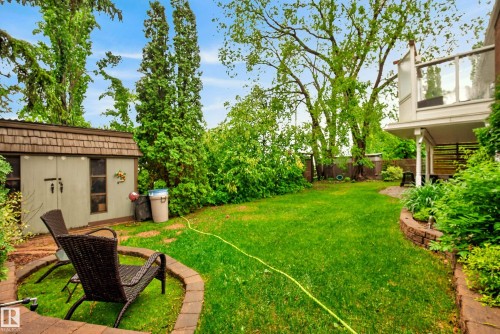 Expansive lawn with mature trees, offering a private outdoor space - 78 Goodridge Drive, St. Albert, AB 