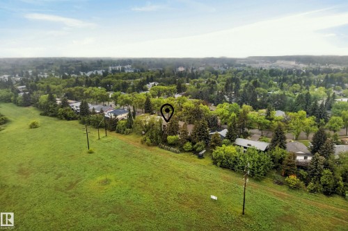 Expansive green space bordering a residential area with mature trees - 78 Goodridge Drive, St. Albert, AB 