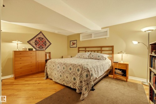 Room featuring wood-finish flooring, a neutral wall color, and a low-profile window - 78 Goodridge Drive, St. Albert, AB 
