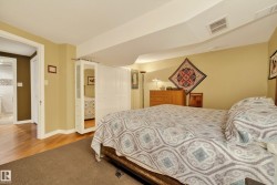 Bedroom featuring carpet flooring, warm toned walls, and recessed lighting - 
