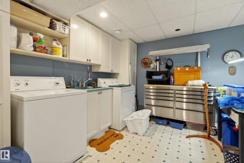 Laundry area featuring white cabinetry, a utility sink, and ample counter space - 78 Goodridge Drive, St. Albert, AB 