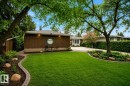 Expansive front lawn with brick-edged landscaping - 78 Goodridge Drive, St. Albert, AB 