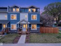Modern multi-level exterior featuring blue and white siding with stone-finish accents - 12604 116 Avenue, Edmonton, AB 