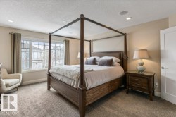 Large Primary Bedroom featuring East Facing Windows, Double Doors, and Ensuite - 