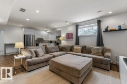 Basement Living Room in legal Secondary Suite with Open Concept to Third Kitchen Space - 