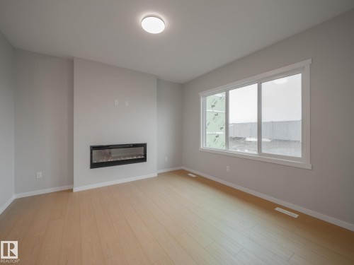 19430 22A Avenue, Edmonton, AB - Indoor Photo Showing Living Room With Fireplace