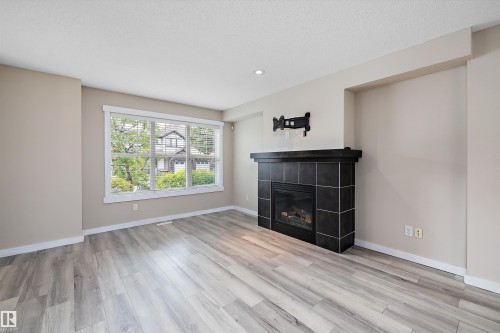 2914 18A Avenue, Edmonton, AB - Indoor Photo Showing Living Room With Fireplace