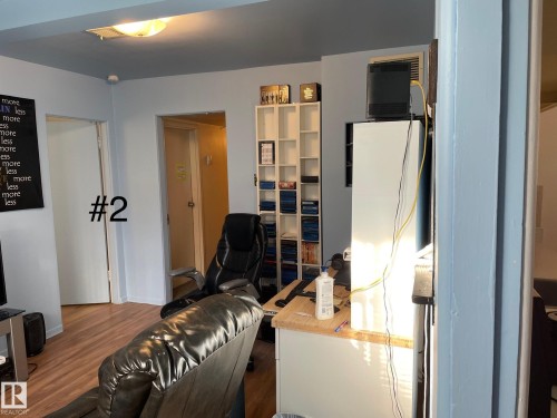 Wood-finish flooring throughout the space - 10017 113 Street, Edmonton, AB 