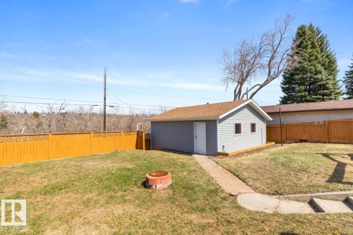 Detached outbuilding with gray siding and brown shingle roof - 4508 109A Avenue, Edmonton, AB 