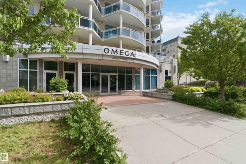 Modern high-rise building with a curved glass and metal facade - 901 10504 99 Avenue, Edmonton, AB 