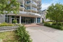 Modern high-rise building with a curved glass and metal facade - 901 10504 99 Avenue, Edmonton, AB 