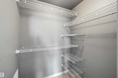 Closet with multiple white wire shelving units - 901 10504 99 Avenue, Edmonton, AB 