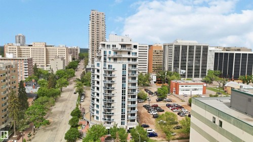 Modern high-rise residential building featuring multiple balconies, a curved facade, and floor-to-ceiling windows - 901 10504 99 Avenue, Edmonton, AB 
