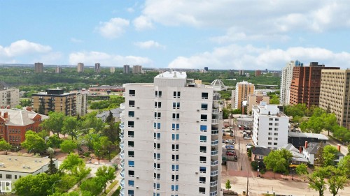 High-rise residential building featuring multiple balconies and a white exterior - 901 10504 99 Avenue, Edmonton, AB 