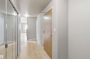 Entryway featuring wood-finish flooring, light neutral wall tones, and recessed ceiling lighting - 901 10504 99 Avenue, Edmonton, AB 