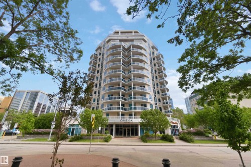 Modern high-rise building featuring a curved architectural design and multiple levels of balconies - 901 10504 99 Avenue, Edmonton, AB 